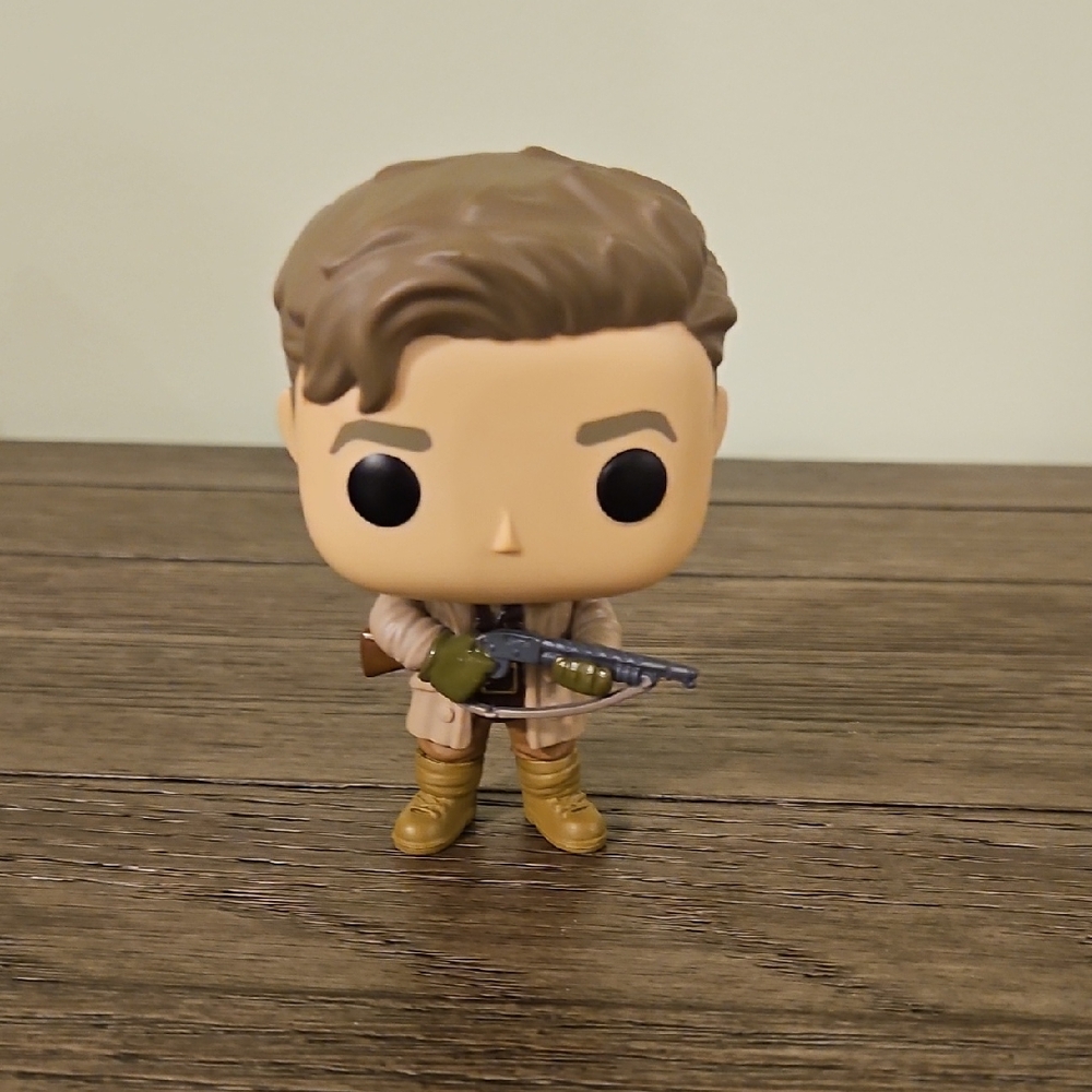 Funko Pop Figure with Brown and Gold Outfit